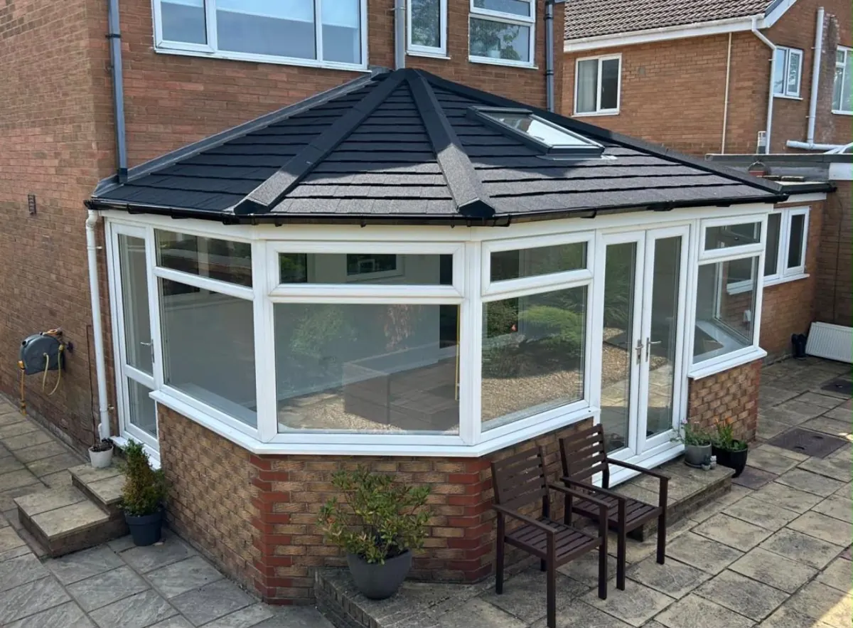 Black tiled conservatory roof with a skylight