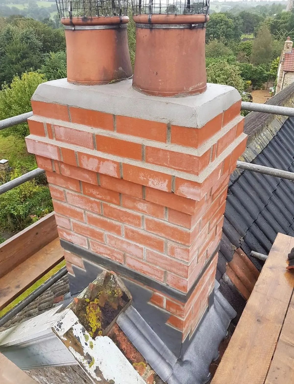Rebuilt brick chimney with two chimney pots