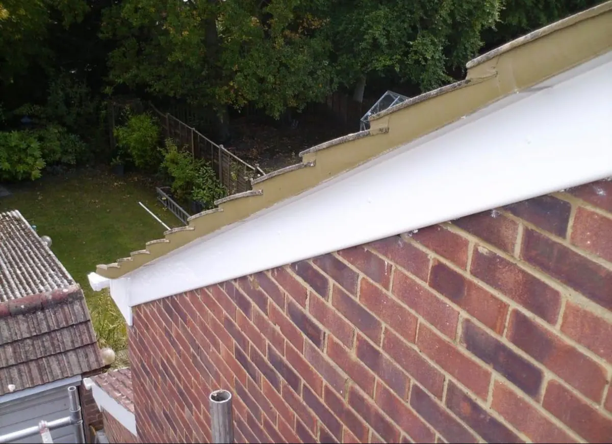 White bargeboard fitted along a brick gable