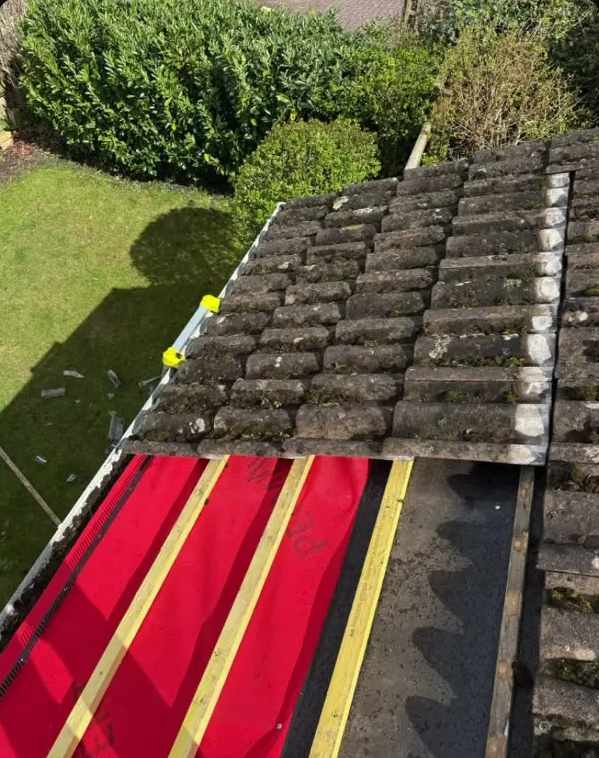 Re-roof in progress with red breathable membrane and new timber battens