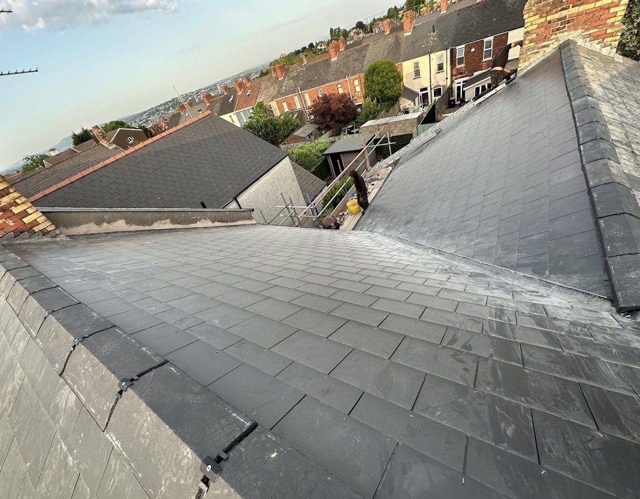New slate roof valley overlooking terraced houses