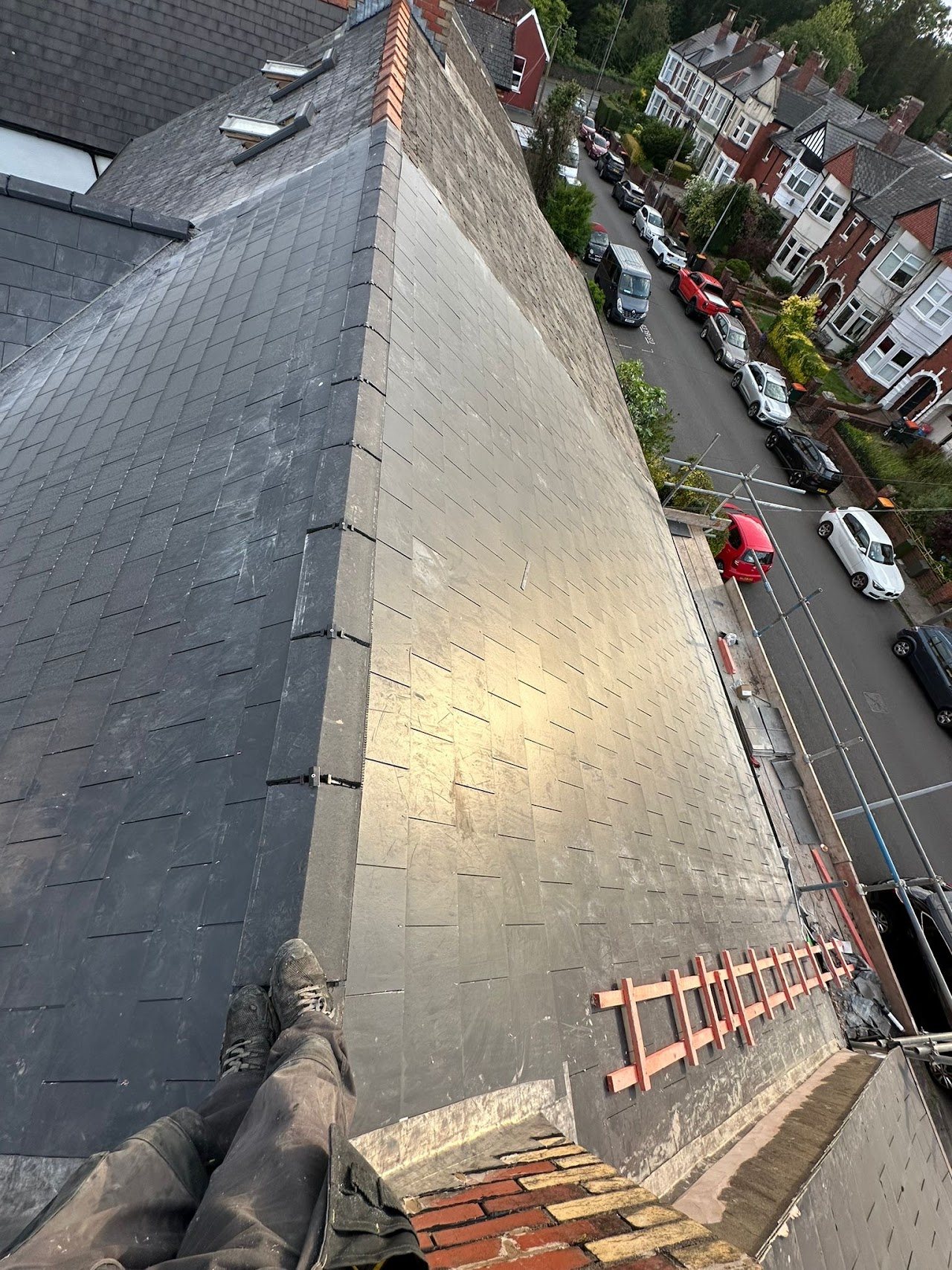 Steep new slate roof looking down over a residential street