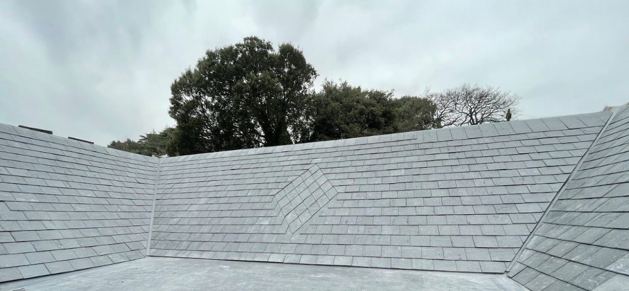 Wide view of a newly slated roof with a valley
